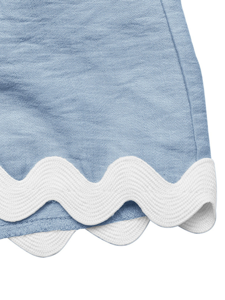 Blue maternity romper cover-up with white scalloped trim detail.