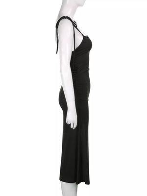 Black ruched midi dress with tie straps and a bodycon fit.