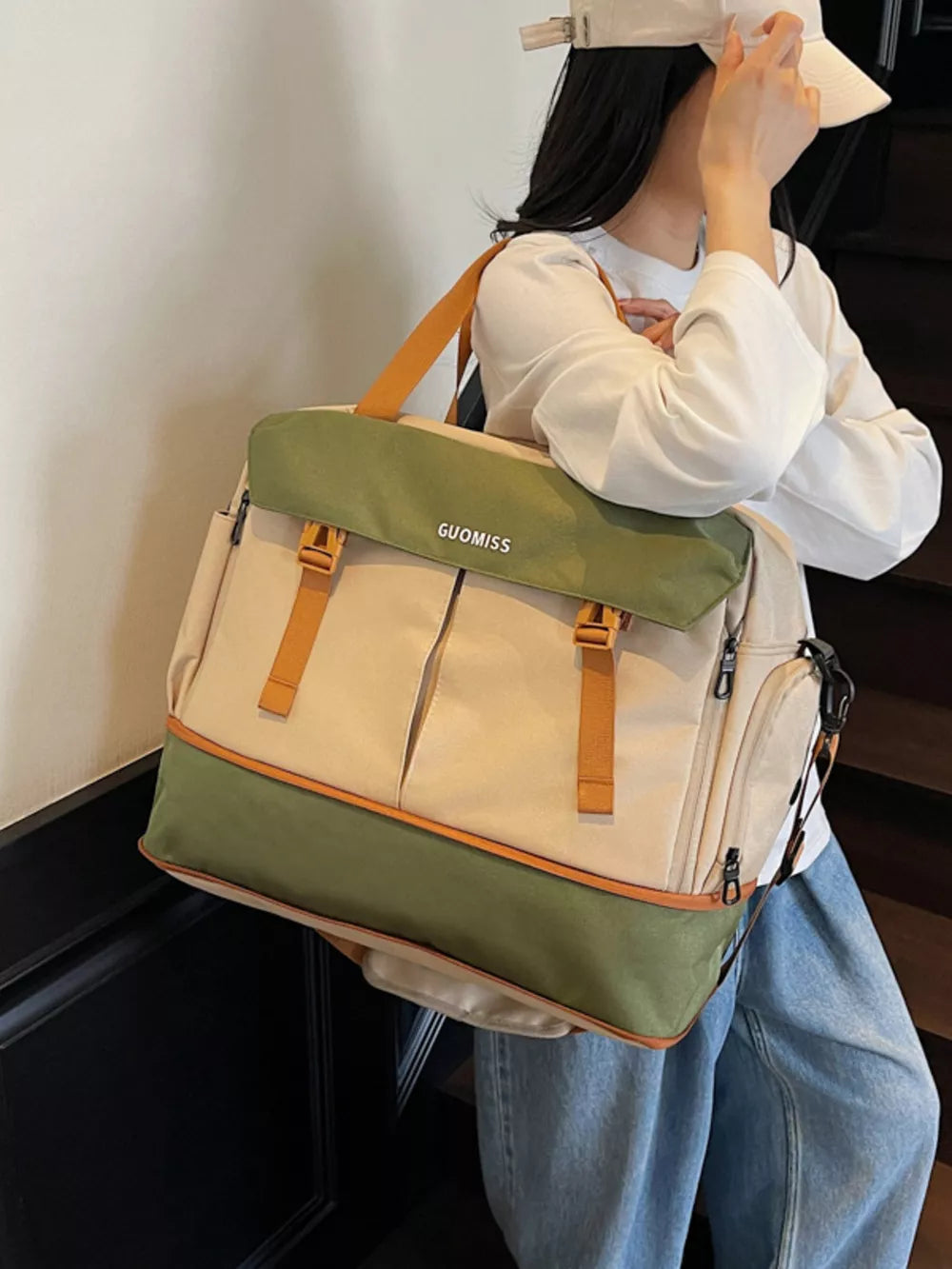 Chic nylon travel bag with olive flap and tan accents, featuring multiple pockets and buckle closures.