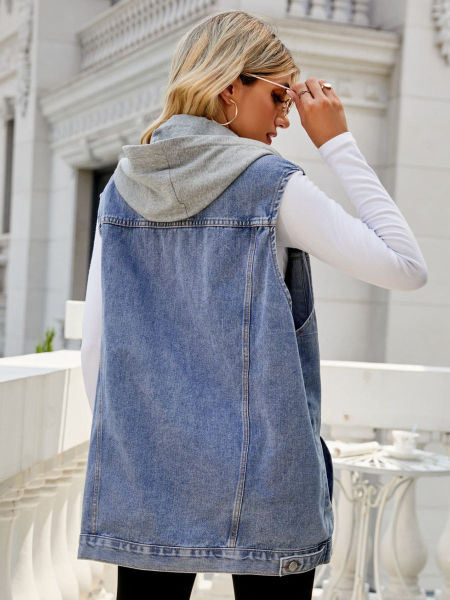 Denim hooded vest in medium wash with grey contrast lining, shown from the back.