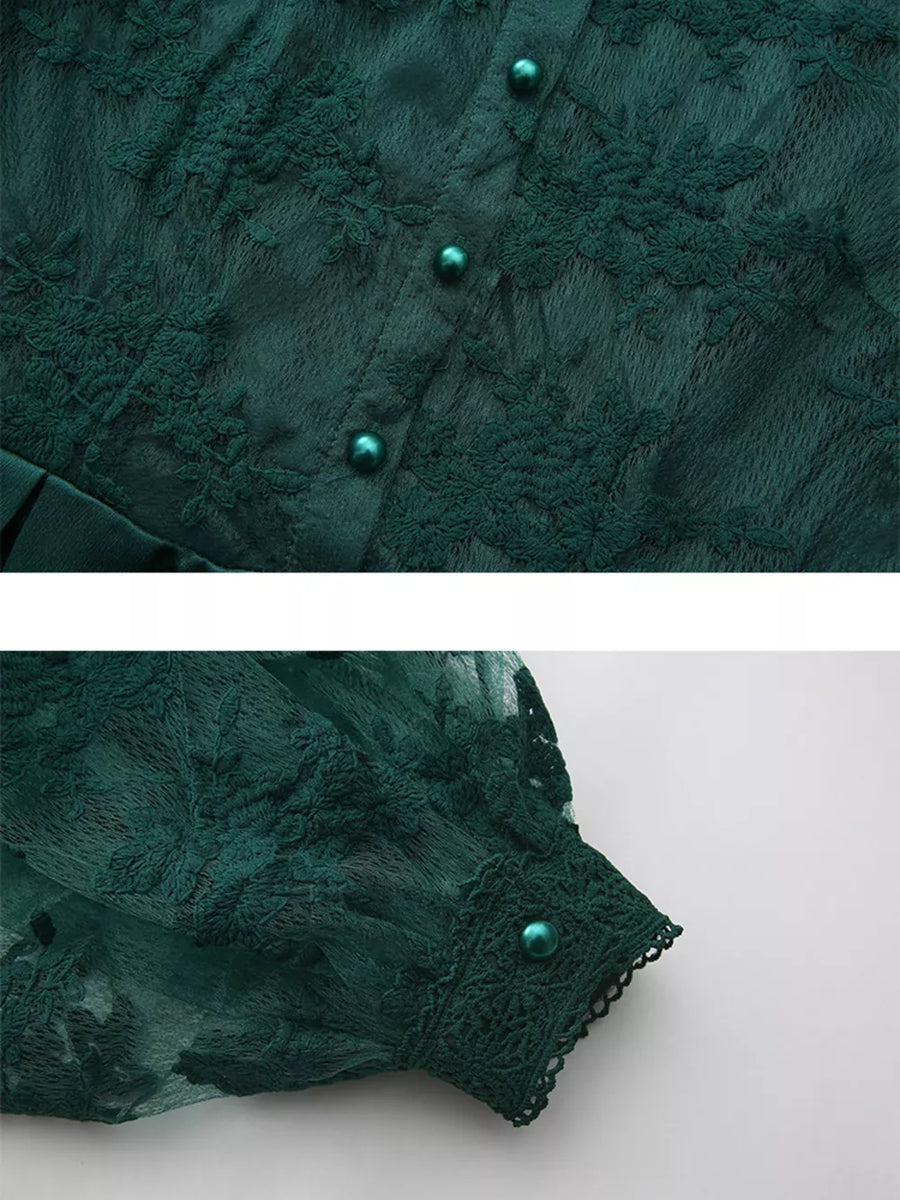 Green lace maxi dress with button front and lantern sleeves.