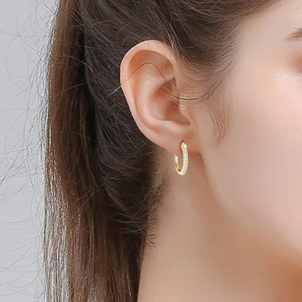 Gold pave-set mini hoop earrings with clear stones