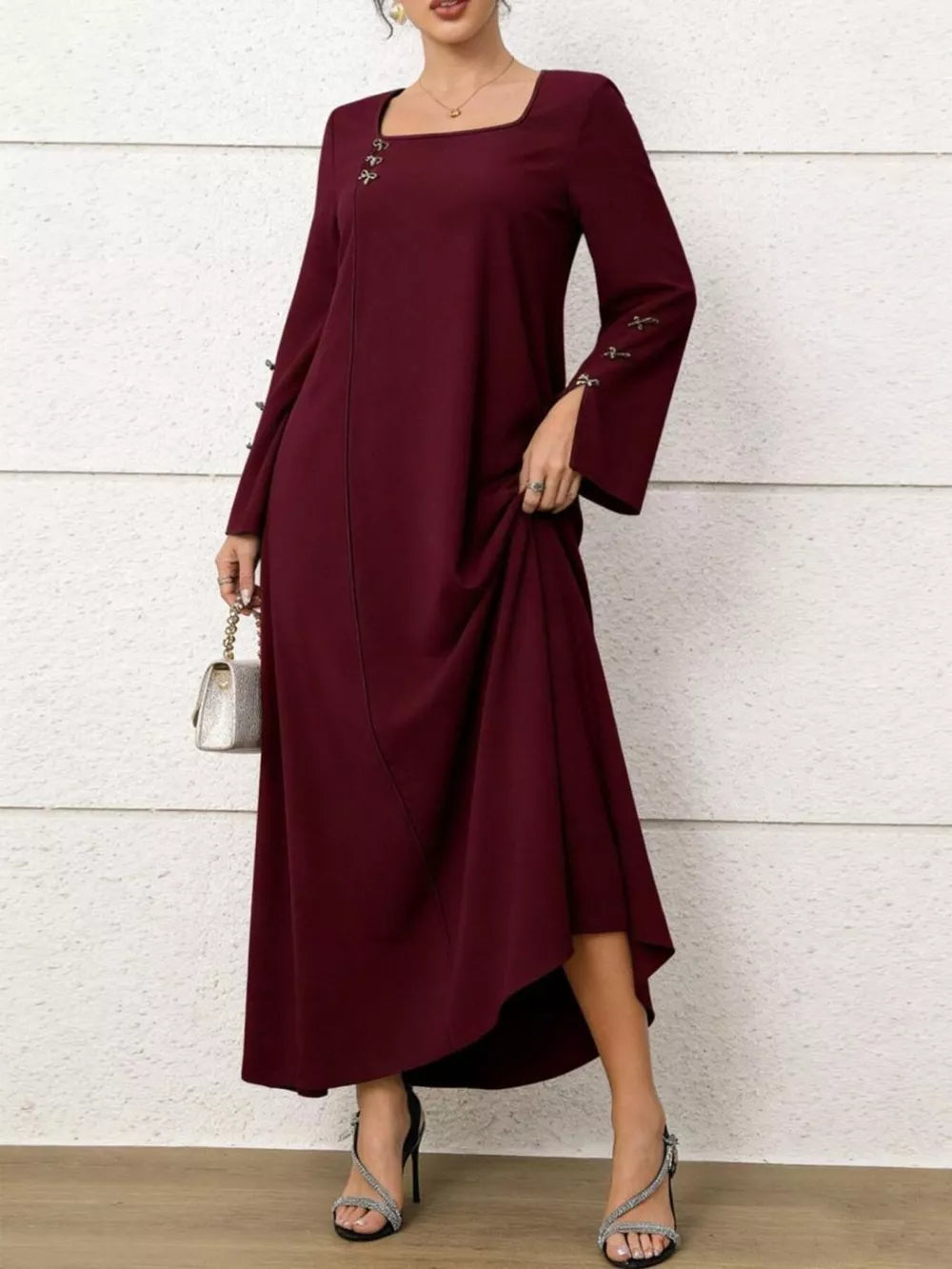 Maroon maxi dress with square neck, flare sleeves, and decorative buttons.