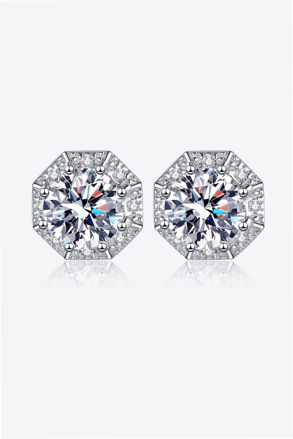 Octagonal halo moissanite stud earrings in silver with sparkling accents.
