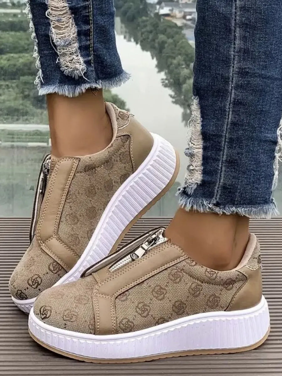 Tan logo print zip-up platform sneakers with white soles.