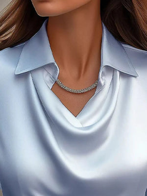 Sky blue satin cowl neck long-sleeve blouse with a collared neckline.