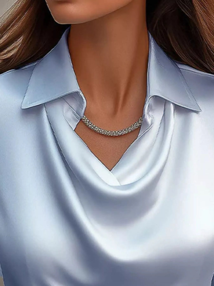 Sky blue satin cowl neck long-sleeve blouse with a collared neckline.