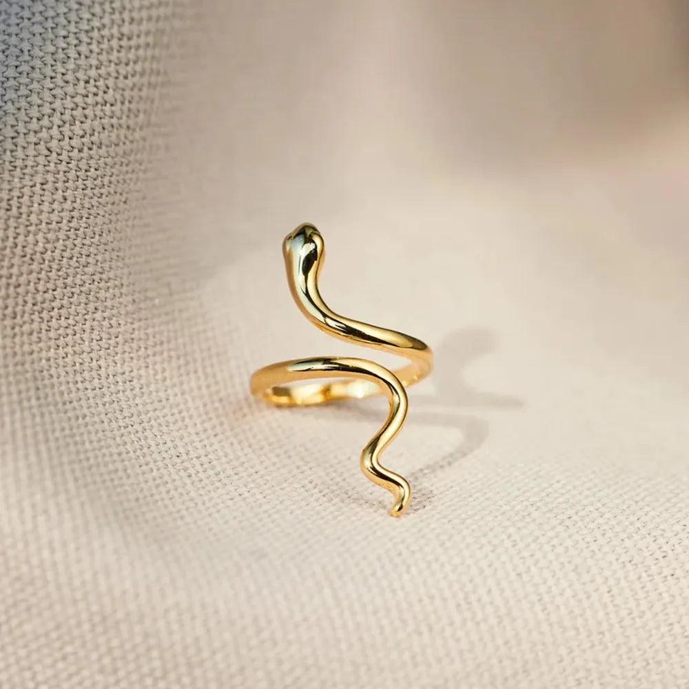 Gold finish serpentine coil ring with sculptural snake design