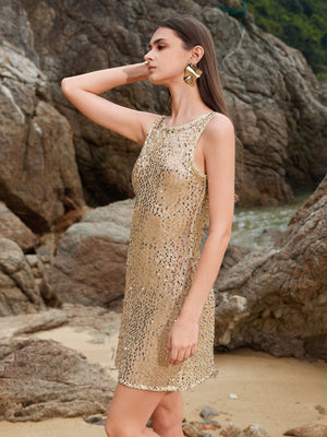 Sleek gold sequin mini cover-up dress with a sleeveless, round neck and a relaxed fit.