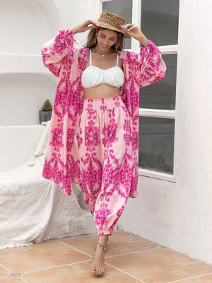 Bohemian paisley lounge set in hot pink with wide sleeves and smocked waist pants.