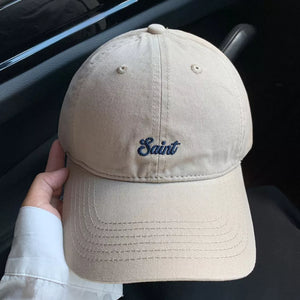 Khaki cotton baseball cap with embroidered "Saint" script design