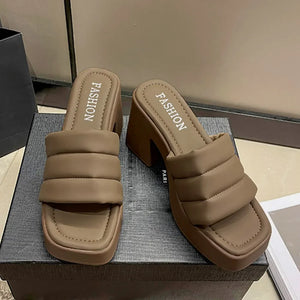 Padded platform mules in mocha with a block heel and square toe.
