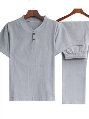 Men's light gray casual two-piece set with band collar and drawstring pants.