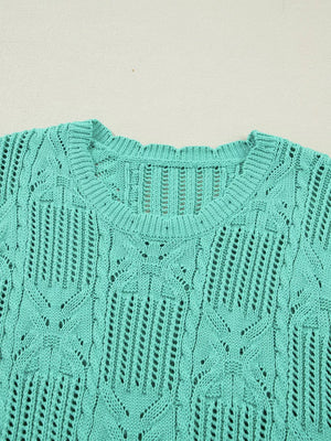 Teal pointelle knit sweater with scalloped trim and open knit details.