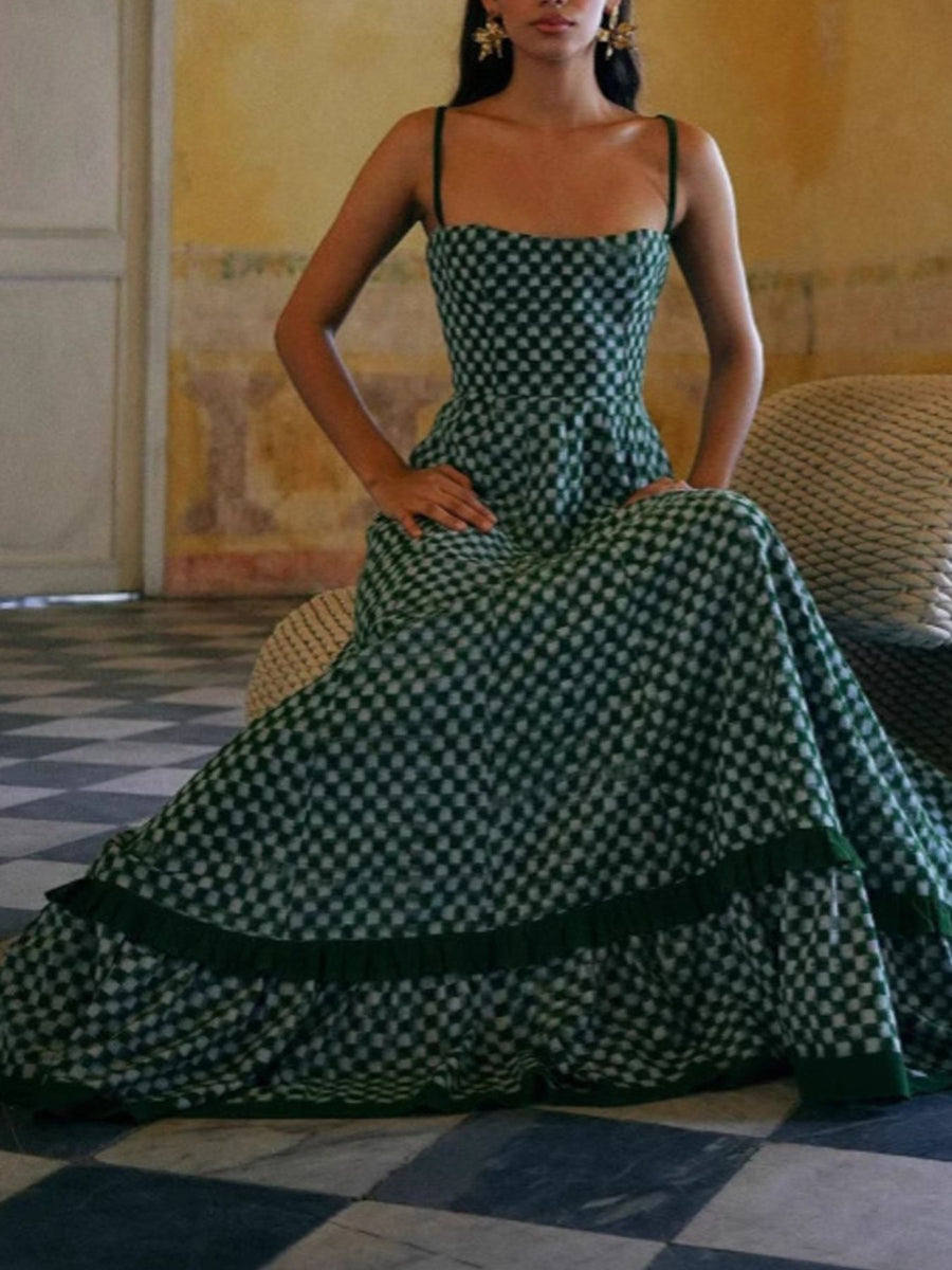 Green checkered maxi dress with spaghetti straps and ruffled hem.