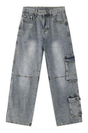 Medium wash denim cargo pants with wide legs and multiple utility pockets.