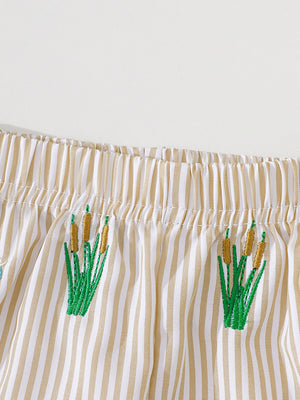 Baby shorts with tan and white stripes and embroidered cattails.