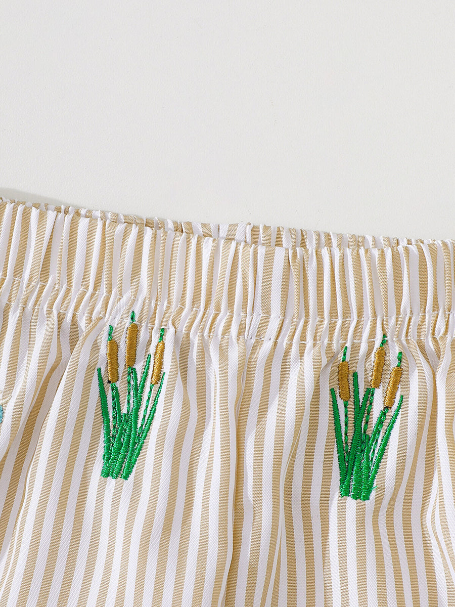 Baby shorts with tan and white stripes and embroidered cattails.