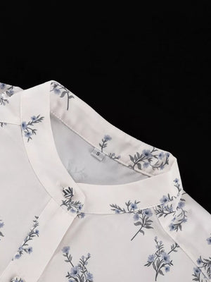 White floral print blouse with mandarin collar and button detail