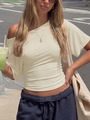 Apricot draped tie-front short sleeve t-shirt with asymmetrical neckline.
