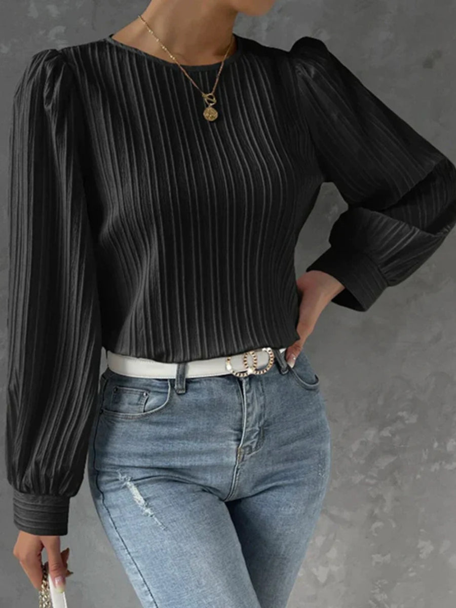 Black pleated sleeve blouse with gathered shoulders and crew neck.