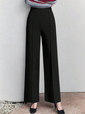 Black high-waisted wide leg cotton trousers with pockets and front seams.