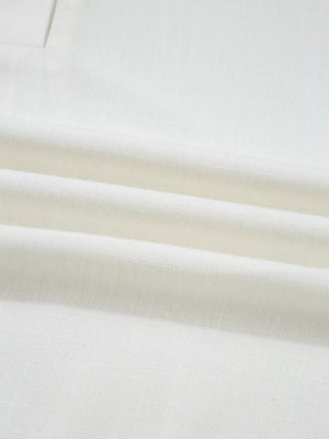 White linen fabric with visible weave and subtle texture.