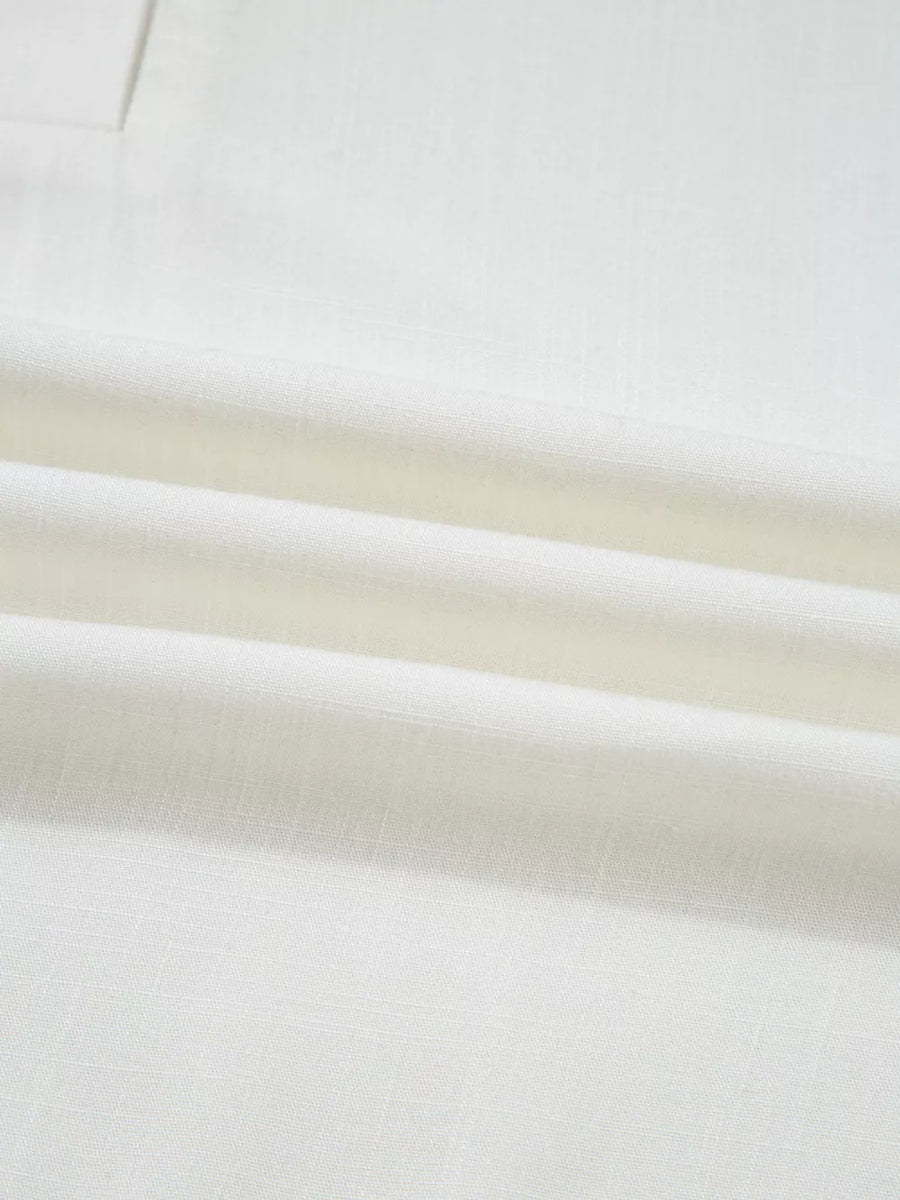 White linen fabric with visible weave and subtle texture.
