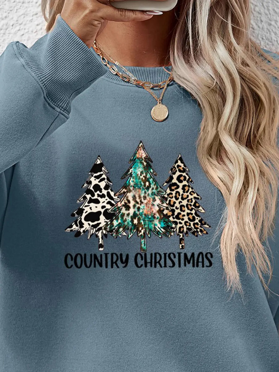 French Blue sweatshirt with country Christmas trees graphic and text.