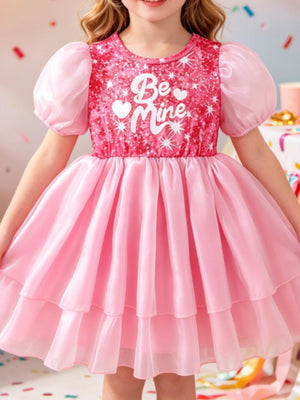 Pink sequin baby dress with puff sleeves and "Be Mine" graphic, tiered skirt