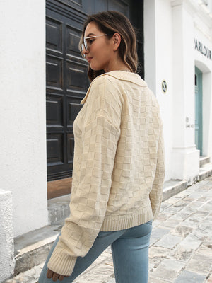 Ivory textured polo neck knit sweater with a checkerboard pattern.