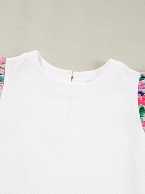 White geometric knit top with floral ruffled sleeves