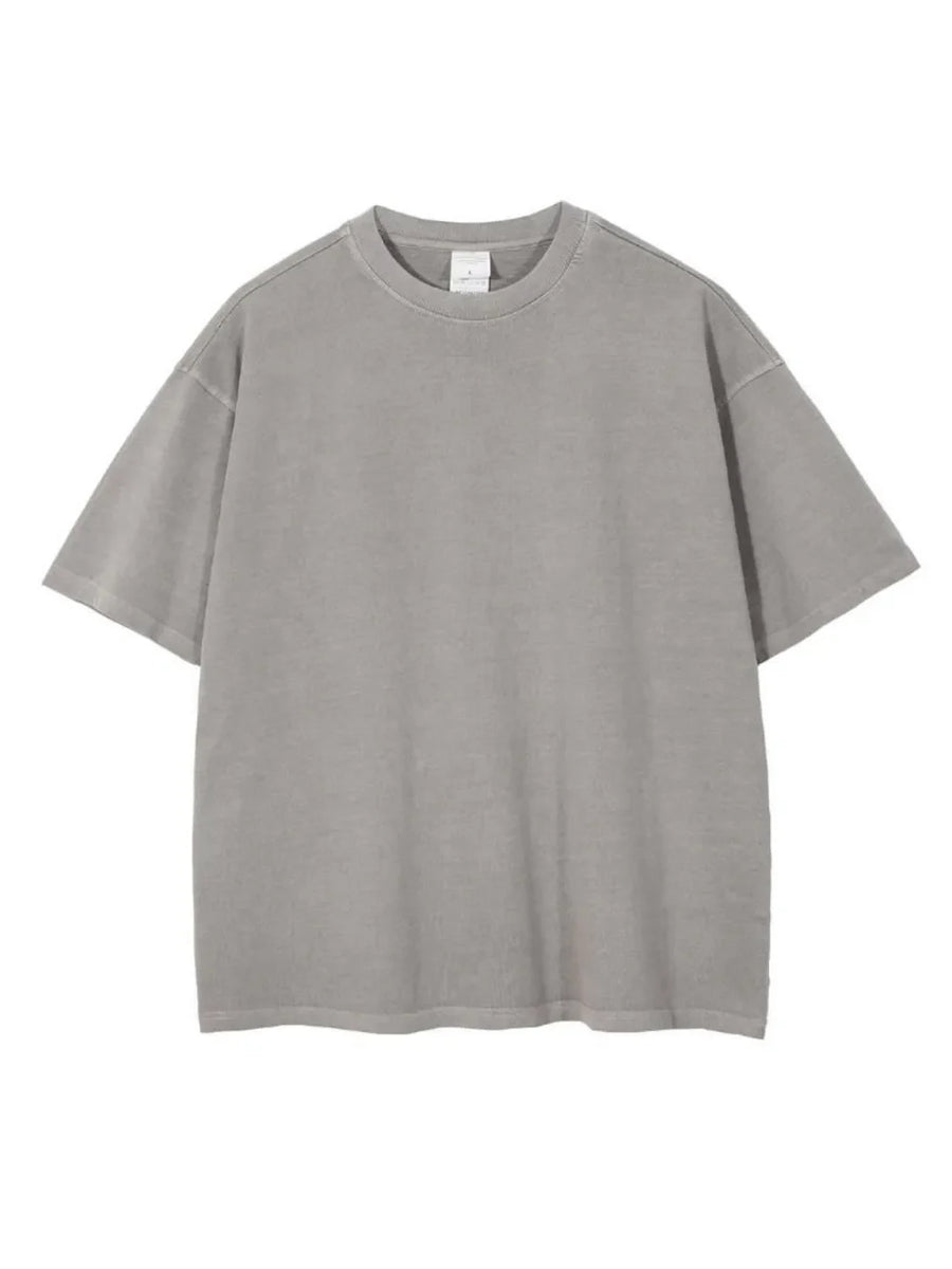 Oversized washed cotton tee in light gray with a relaxed fit and crew neck.