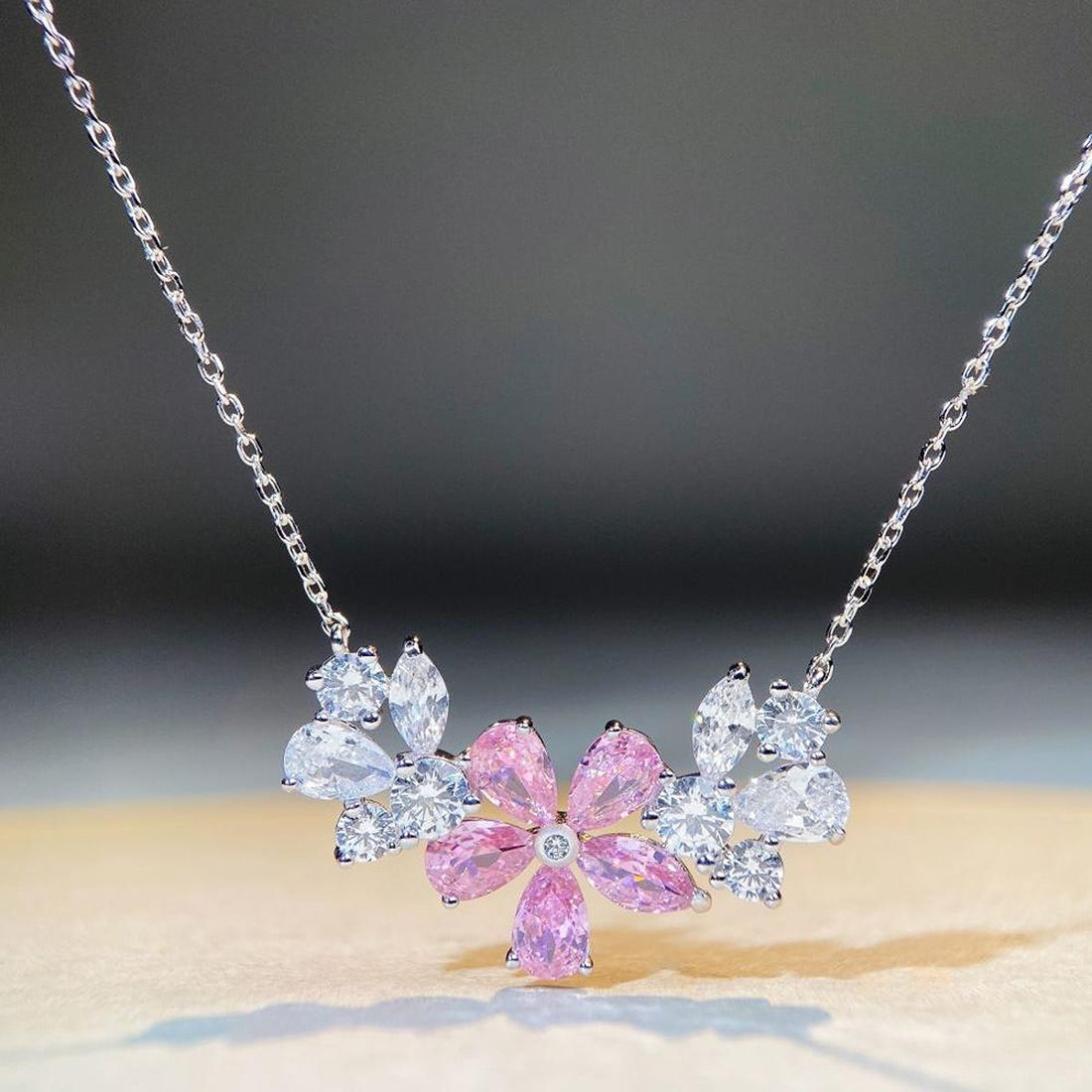 silver necklace featuring zircon embellishment and floral