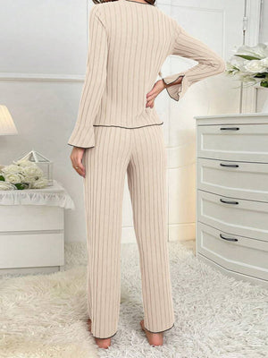 100% polyester Care instructions: Machine wash cold pajama set in Black with slim silhouette