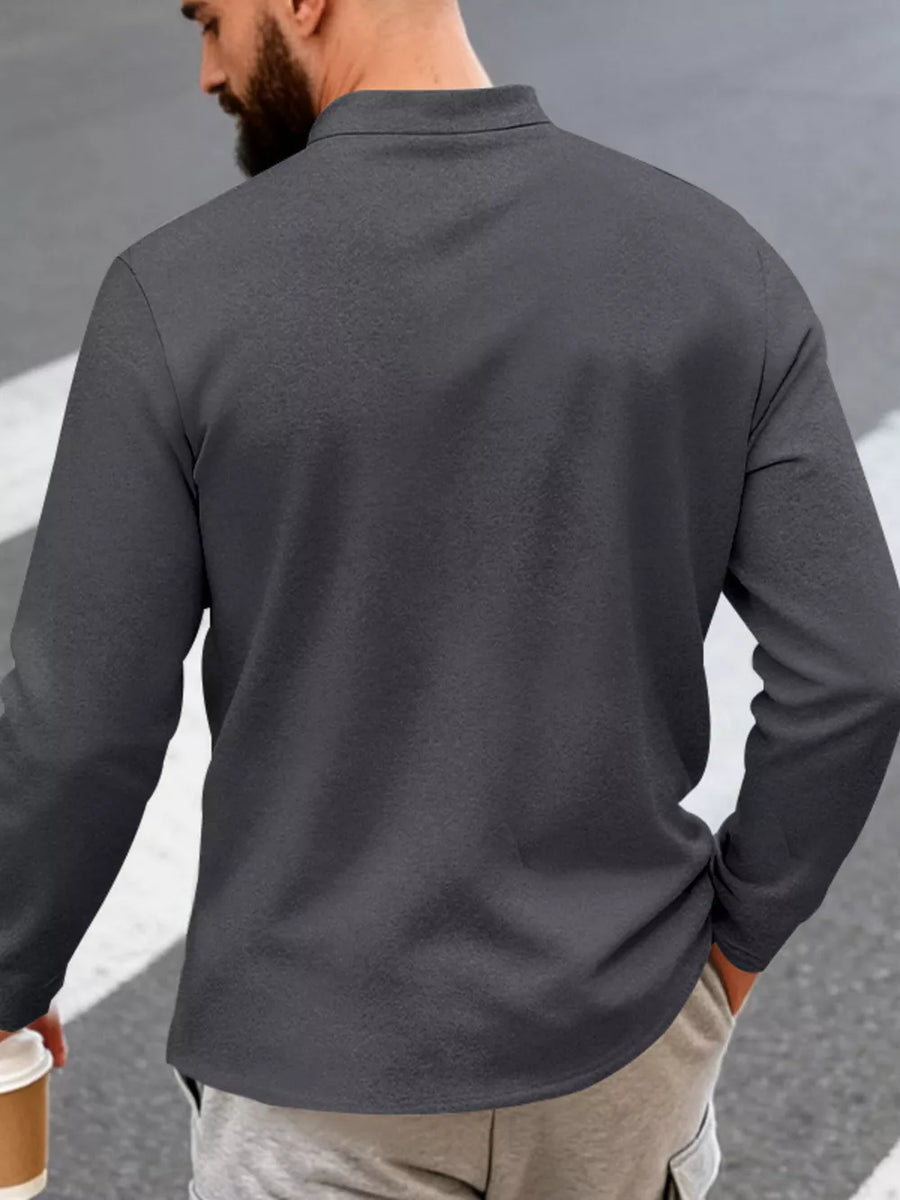 Dark Gray long sleeve overshirt with band collar and button detail, worn casually.