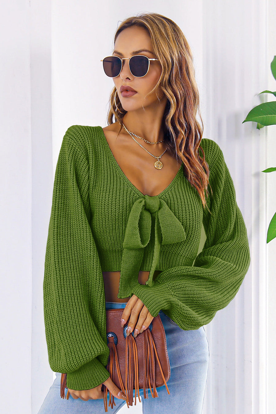 Green acrylic tie-front balloon sleeve crop knit sweater with V-neck.