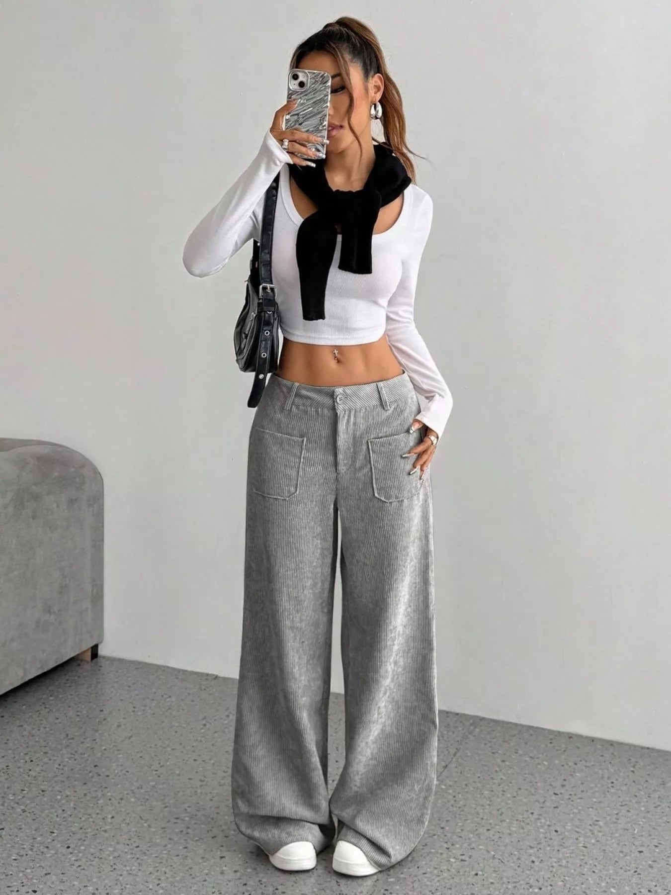 Chic grey corduroy wide-leg trousers with front pockets and a comfortable fit.