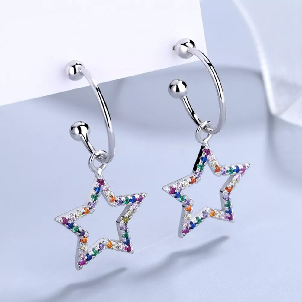 Silver earrings featuring rhinestone embellishment and star