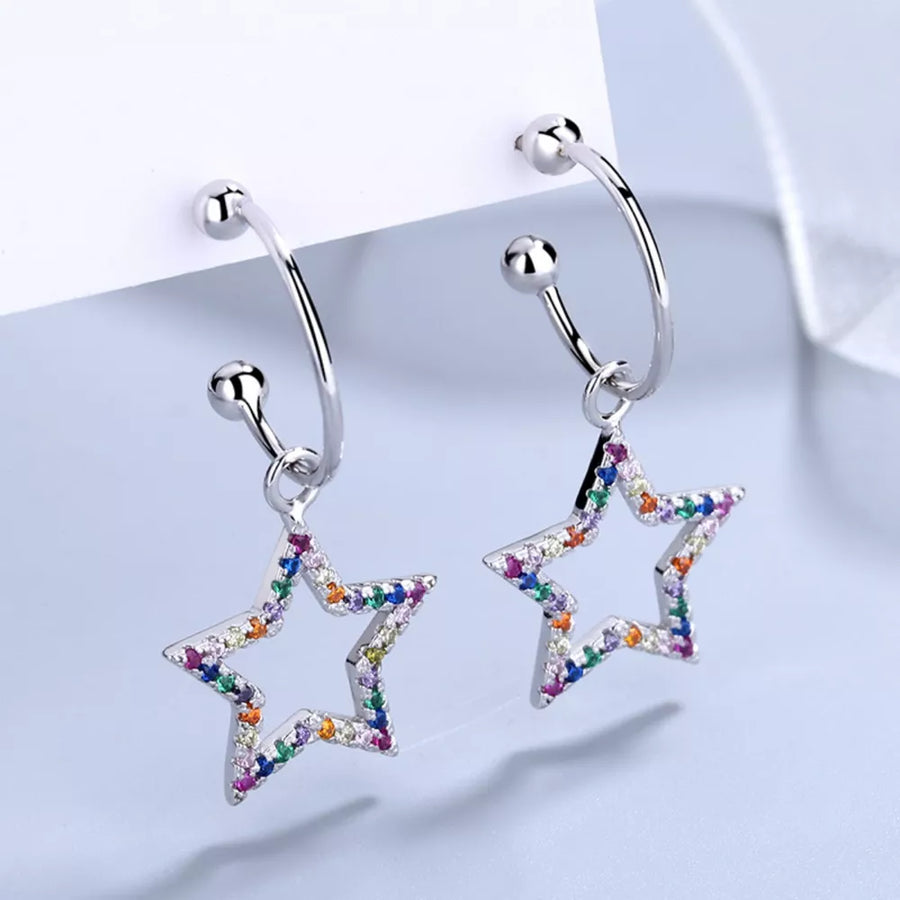 Silver earrings featuring rhinestone embellishment and star