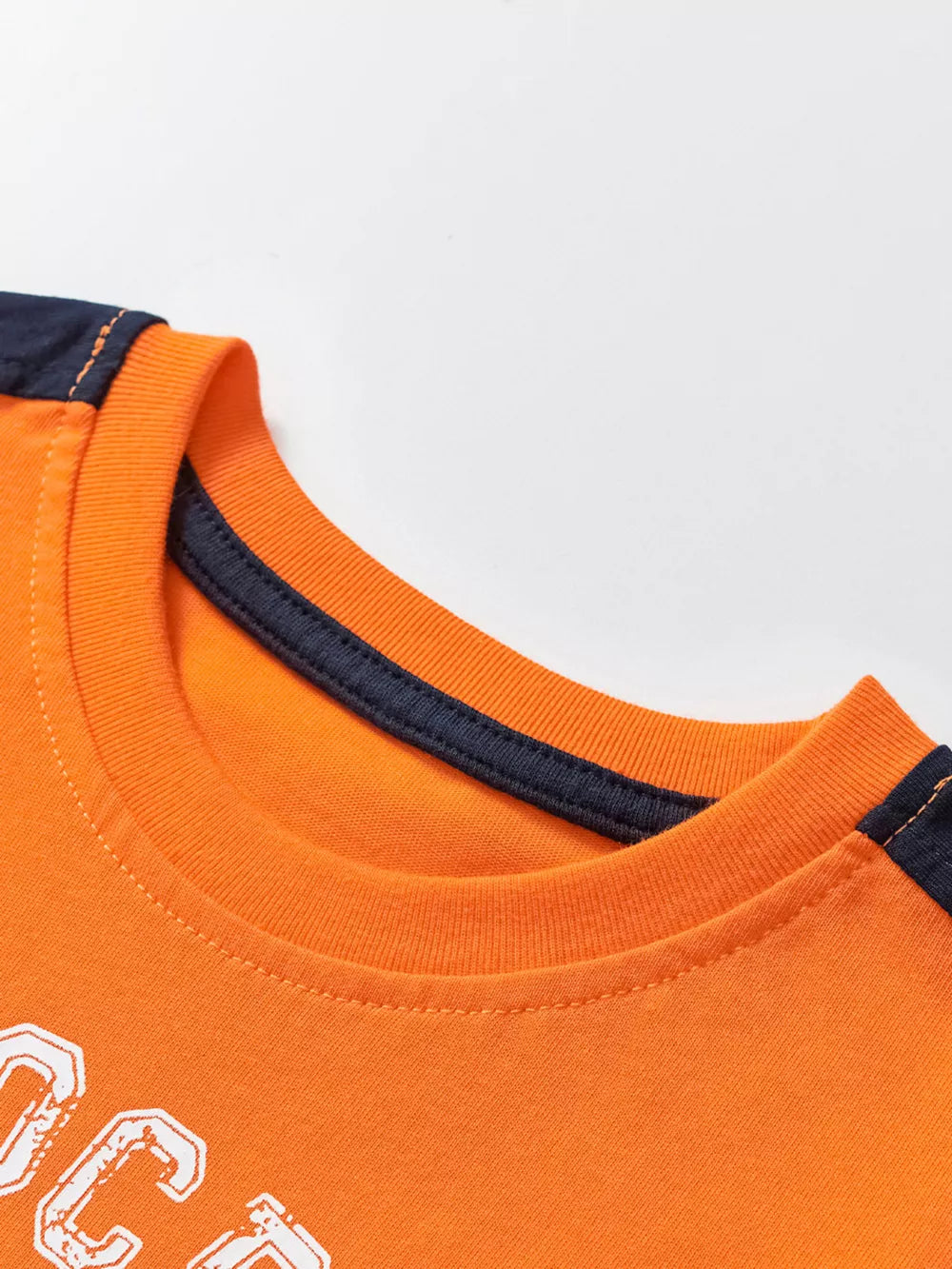 Orange cotton graphic t-shirt with navy trim and stitching detail