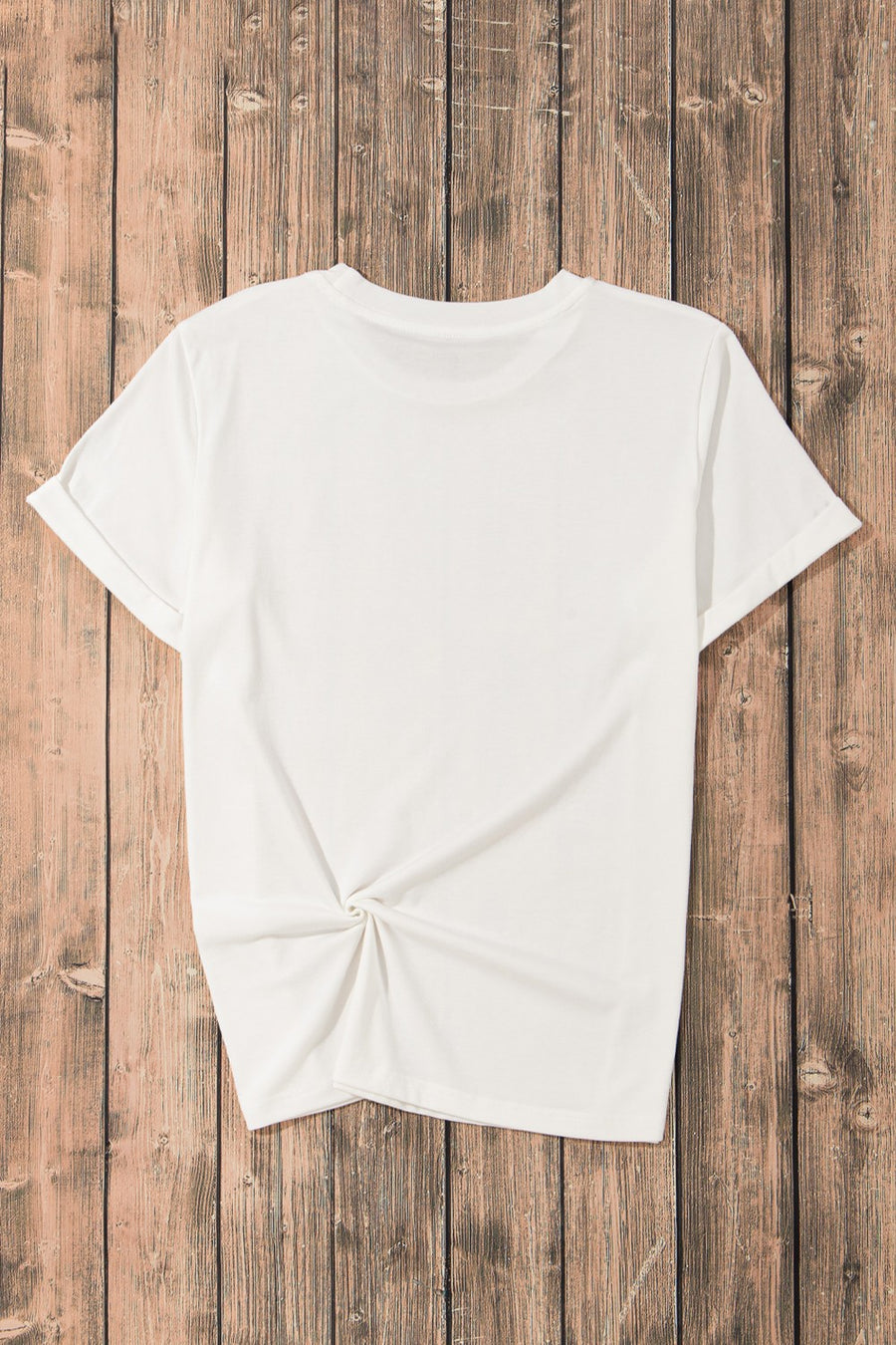 White t-shirt with cuffed sleeves and a knotted hem detail.