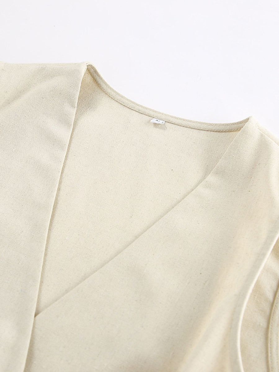 Cream cotton buttoned vest with V-neckline detail