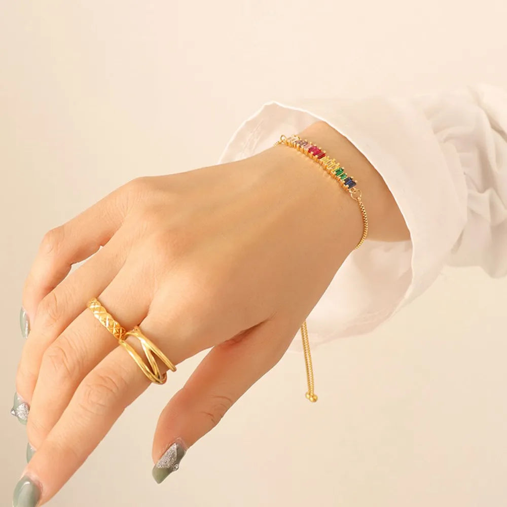 Gold bracelet with multicolor baguette zirconia stones and adjustable clasp