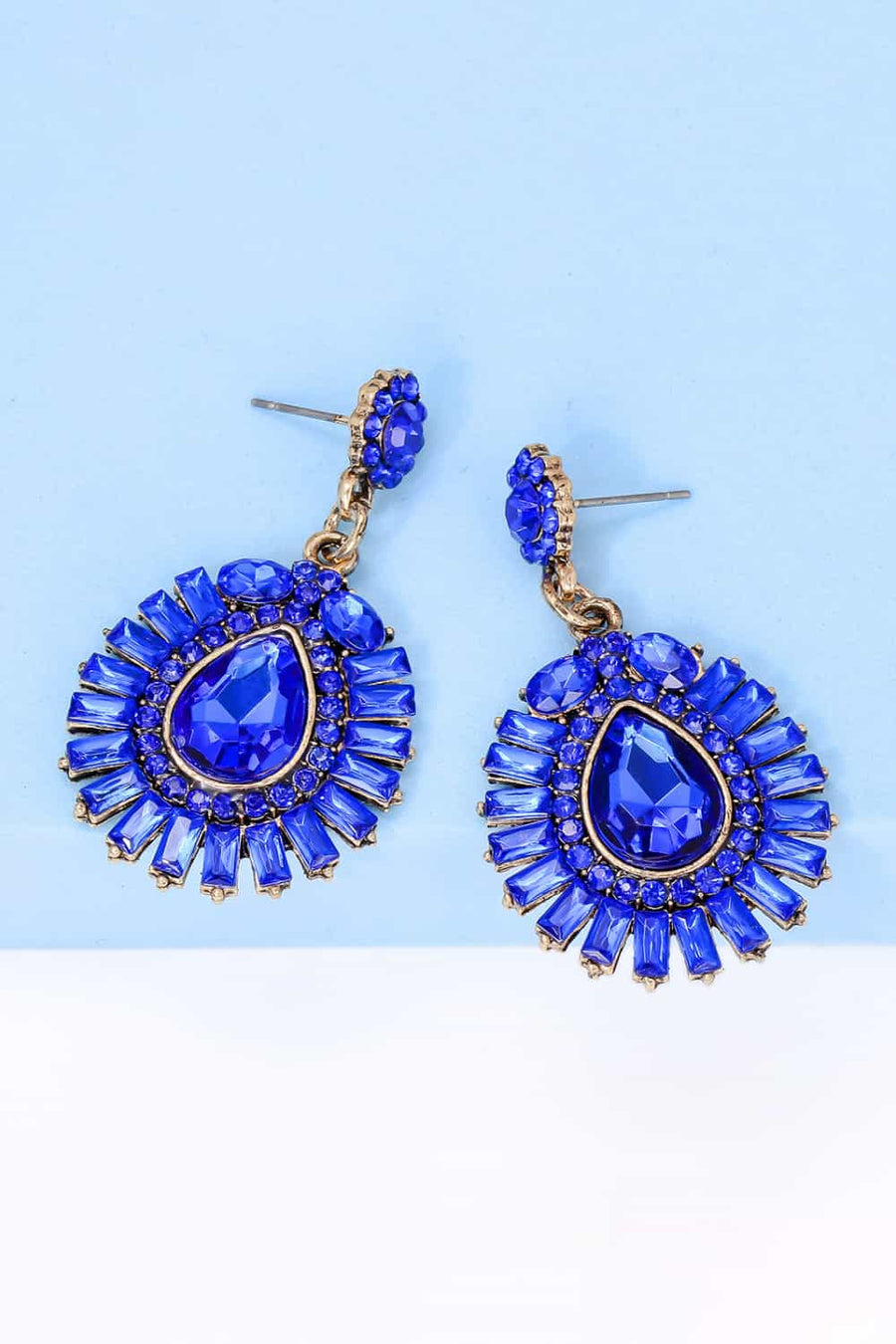 Royal blue gemstone burst dangle earrings with gold-tone metal.