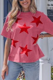 Festive Star Print Mineral Wash Tee in pink, 100% cotton, with a bold red star pattern.