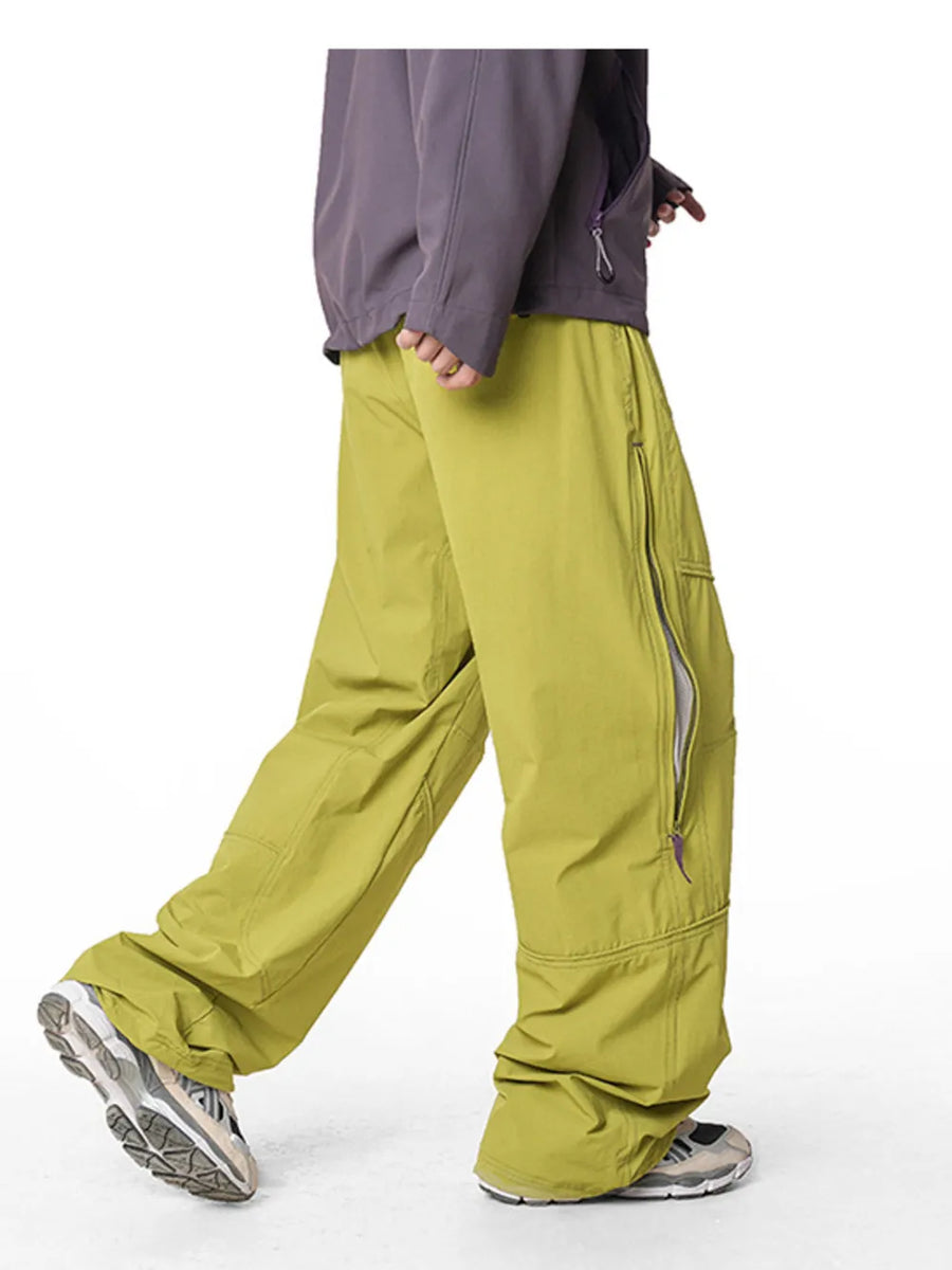 Relaxed fit cargo pants in Mustard Yellow with zippered pockets and drawstring waist.