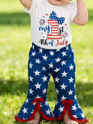 Patriotic baby bodysuit with "My 1st 4th of July" graphic and star flare pants with red bows.