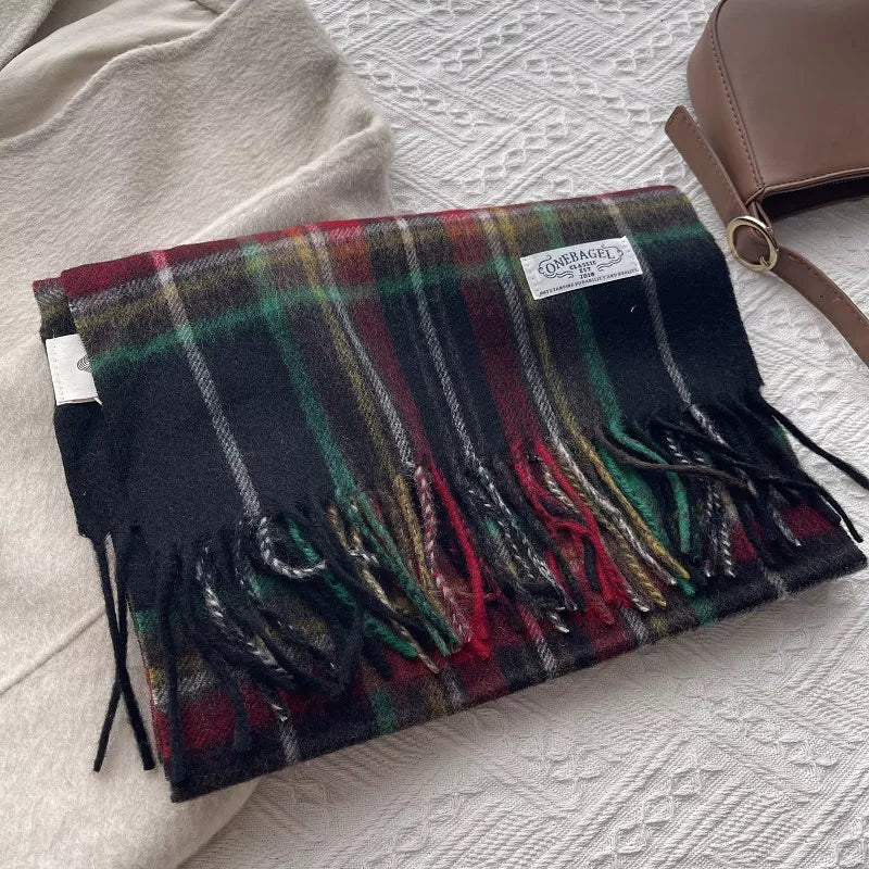 Classic wool plaid scarf with tassels in burgundy, green, and yellow on black.