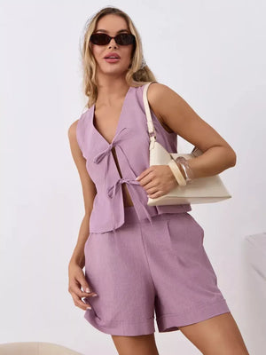 Purple cotton tie-front sleeveless top and cuffed shorts set.